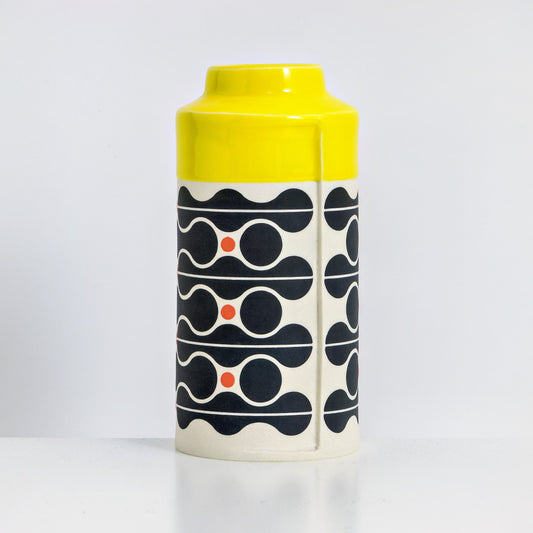 Can with yellow glaze, wave pattern in black and red