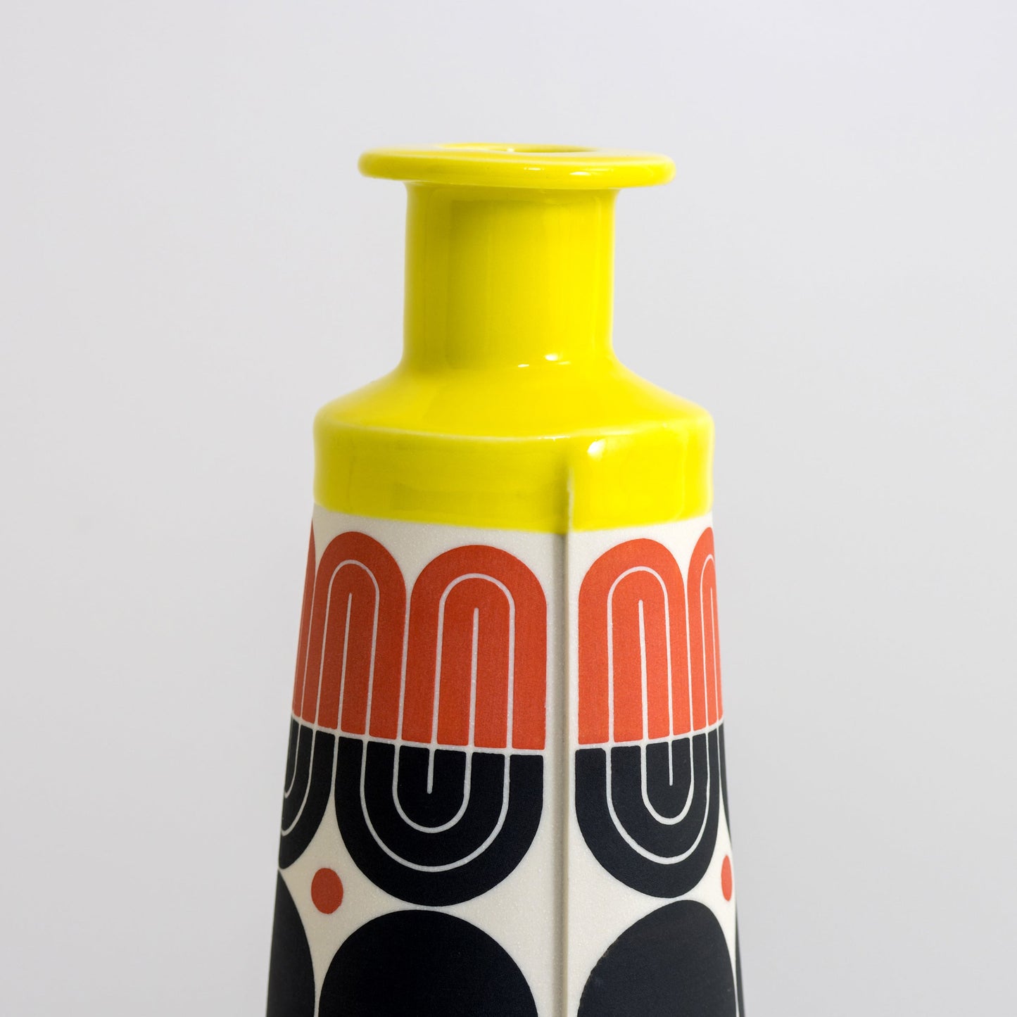 Cone Bottle with yellow glaze, tracery pattern in red and black