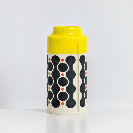 Cylinder with yellow glaze, waterfall pattern in black and red