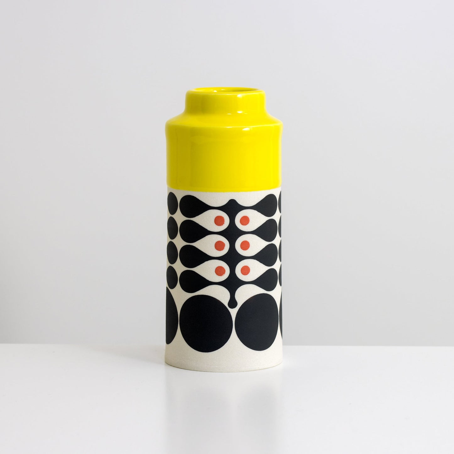 Cylinder with yellow glaze, vertical seaweed pattern in black